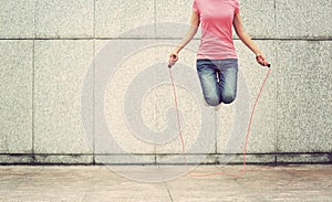 fitness woman jumping rope outdoor