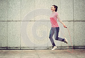 Fitness woman jumping rope outdoor