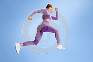 Fitness woman jumping and running, working out. Athletic girl doing jump