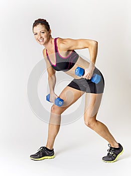 Fitness woman lifting free weights. on a white background