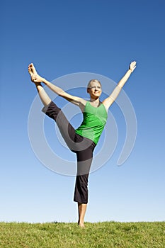 Fitness woman outdoors stretching