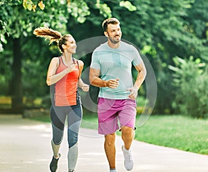 fitness woman park exercise lifestyle outdoor sport healthy couple nature active young fit training athlete man