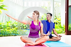 Fitness woman with personal trainer exercising