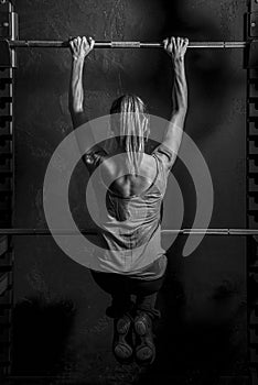 Fitness Woman Pull-ups on Bar