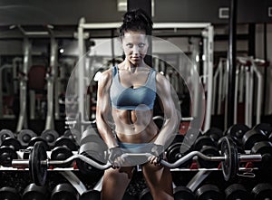 Fitness woman push ups biceps with dumbbell