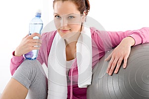 Fitness - woman relax water bottle exercise ball