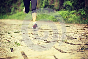 Fitness woman runner running on trail