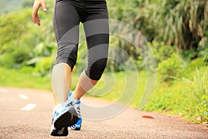 Fitness woman runner running on trail