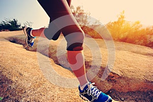 Fitness woman runner running on trail