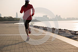 fitness woman running on sunrise coast trail