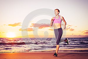 Fitness woman running at sunset