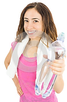 Fitness woman showing a bottle of water