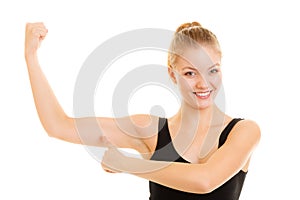 Fitness woman showing energy flexing biceps muscles.