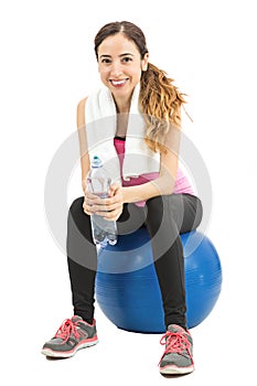 Fitness woman sitting on a pilates ball