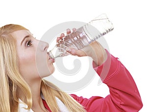 Fitness woman sport girl with towel drinking water from bottle isolated