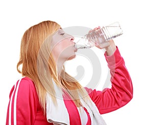 Fitness woman sport girl with towel drinking water from bottle isolated
