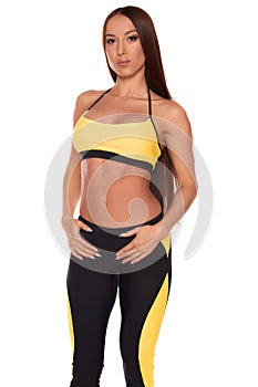 Fitness woman standing against isolated white background