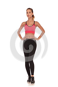 Fitness woman standing with hands on waist