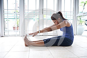 Fitness woman stretching her hamstring