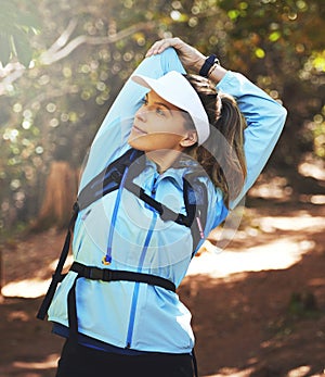 Fitness, woman and stretching for hike or exercise on trail run for workout goals or running challenge. Sport, female