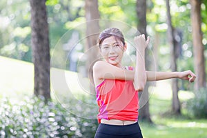 Fitness woman stretching muscles before sport activity, Woman gym in park morning exercise, Young sportswoman doing workout