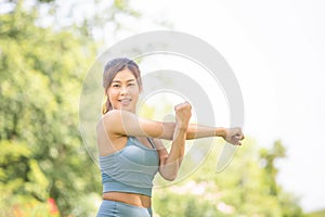 Fitness woman stretching muscles before sport activity, Woman gym in park morning exercise, Young sportswoman doing workout