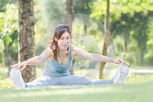 Fitness woman stretching muscles before sport activity, Young sport woman stretching and preparing to run in park