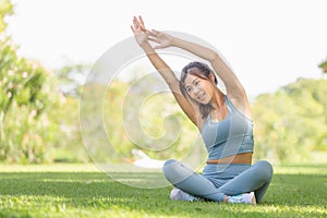 Fitness woman stretching muscles before sport activity, Young sportswoman stretching and preparing to run in park