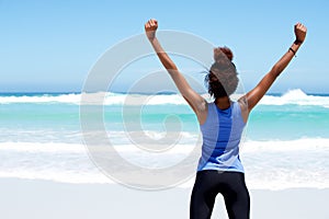 Fitness woman stretching workout at beach