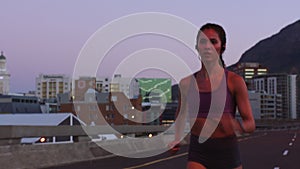 Fitness woman sunset running in urban city for cardio training, marathon sports and healthy exercise outdoor. Focus