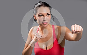 Fitness woman working out at the g isym iolated on white background