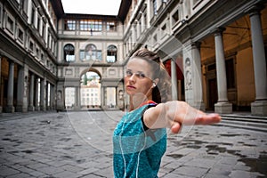 Fitness woman workout near uffizi gallery in florence, italy