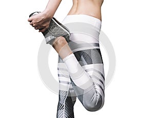 Fitness woman. Young woman doing stretching. Back view. Wearing white leggings and gray sneakers. Isolated on white