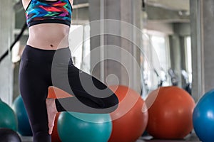 Fitness womans in sportware posing Yoga on Mat in Gym