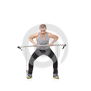 Fitness, workout and resistance band with a strong man in studio isolated on a white background for health. Gym