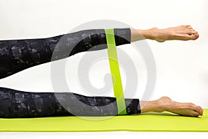 Fitness workout with rubber resistance band