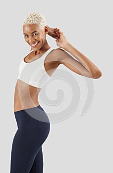 Fitness workout, smiling woman stretching arms and back, african latin american female athlete in sportswear, Sportswoman do