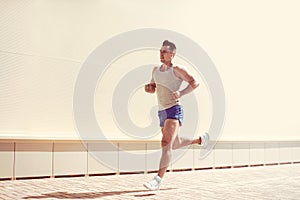 Fitness, workout, sport, lifestyle concept - sportsman running