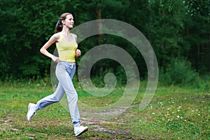 Fitness, workout, sport, lifestyle concept - woman running