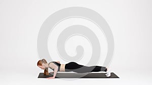 Fitness Workout. Sporty Young Woman Doing Push Ups Exercises In Studio