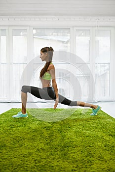 Fitness Workout. Woman Practicing Yoga Exercises Stretching Home