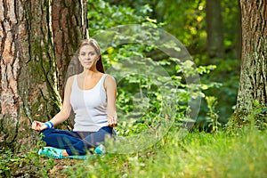 Fitness yoga exercise in wood. Young woman healthy lifestyle portrait