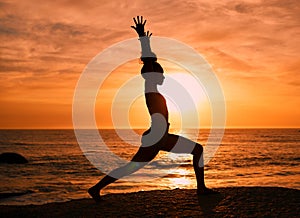 Fitness, yoga and silhouette of woman at sunrise on beach for exercise, training and pilates workout. Motivation