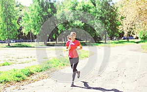 Fitness young woman running in park, female runner workout, sport and healthy lifestyle