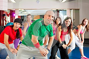 Fitness - Zumba dance workout in gym photo