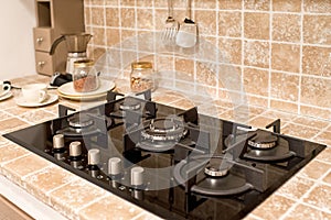 Fitted gas burner in a tiled kitchen counter
