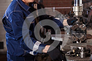 Fitter working on on an automatic welding machine