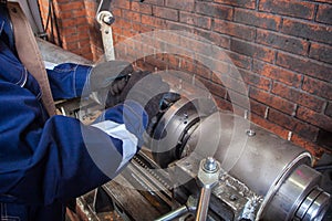 Fitter working on on an automatic welding machine