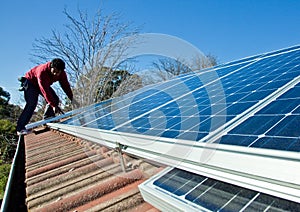 Fitting solar panels to roof