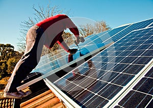 Fitting solar panels to roof of house